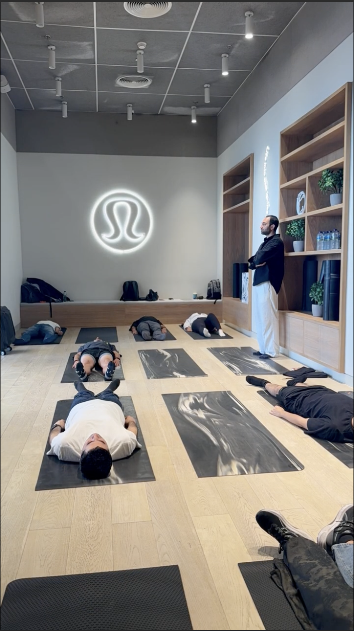Participants in blindfolded meditation at Lululemon