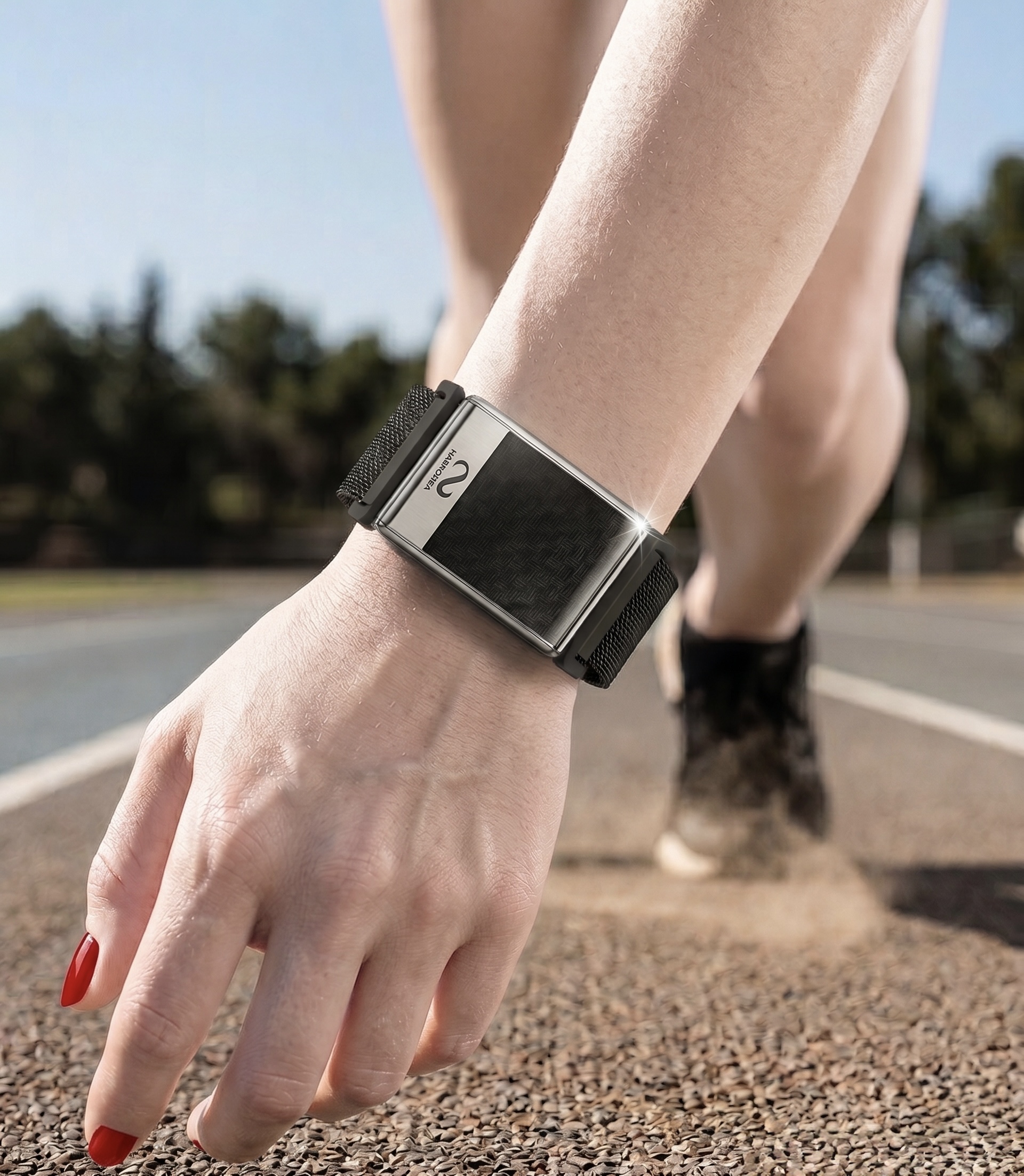 Band on a runner's wrist at the line.